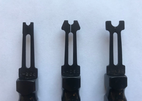 Close up group picture of e-clip tools for size comparison